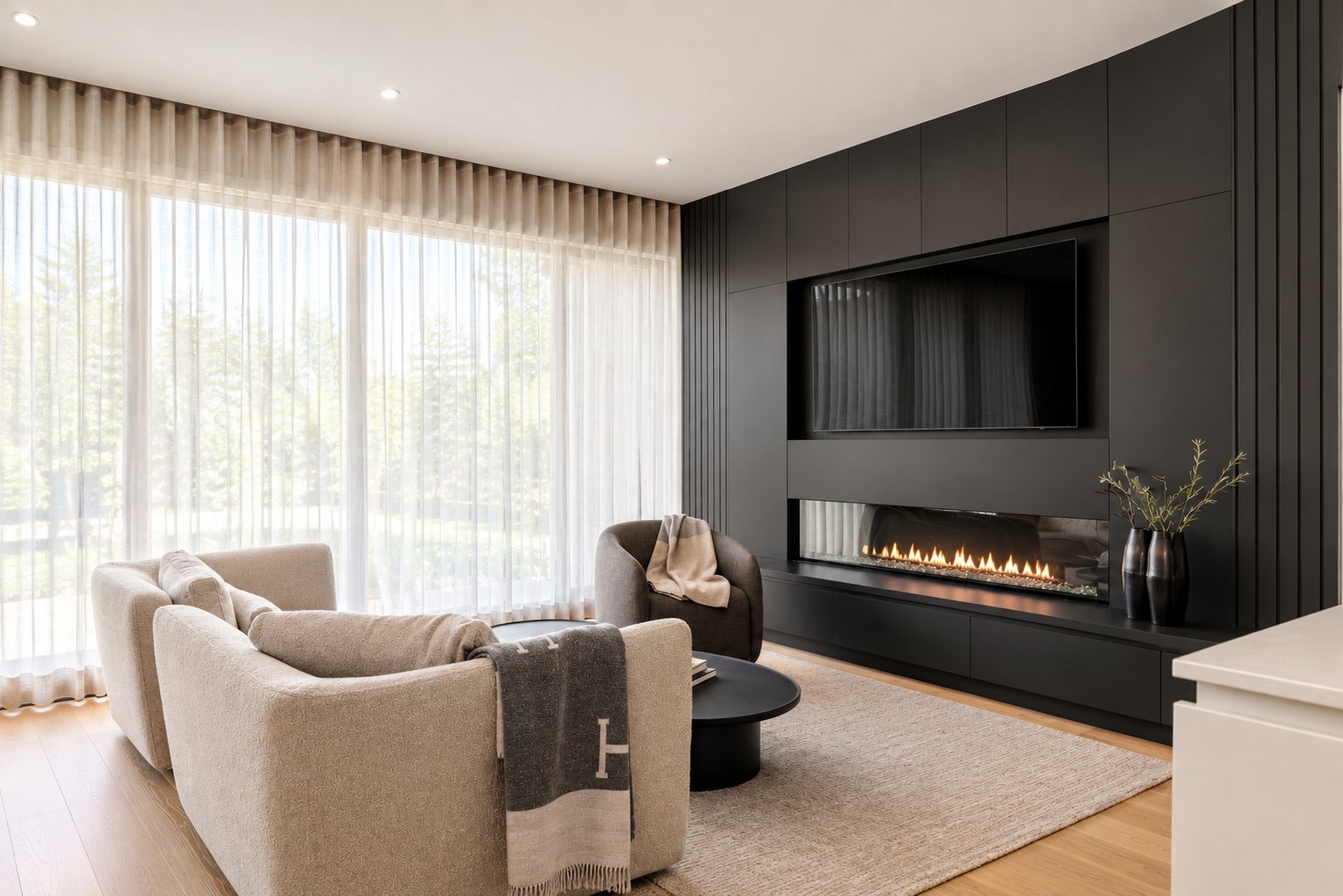 Living room with full-height sheers and an Urbane Bronze built-in fireplace wall