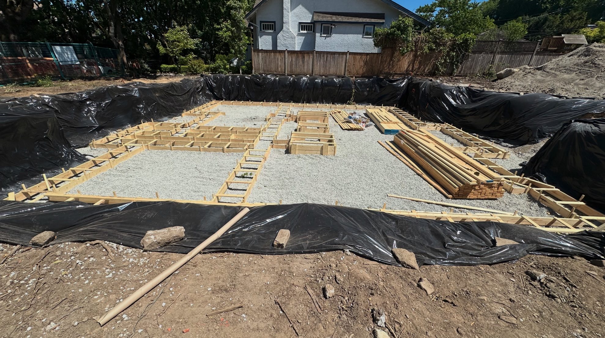 Completed excavation with footing forms laying out the footprint of the house