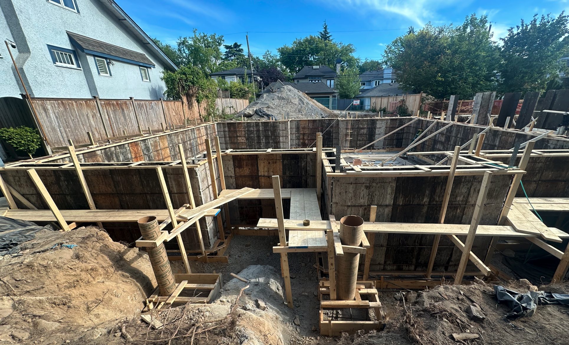 Foundation wall forms set and braced in the excavation