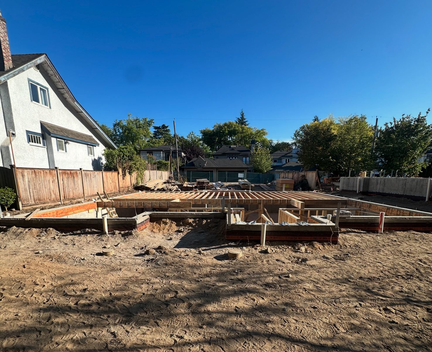 Poured foundation with main floor system going in